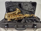 a saxophone that is in a case on a table