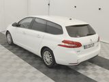 a picture of a white car parked in a garage