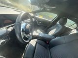 the interior of a car with a steering wheel and dashboard