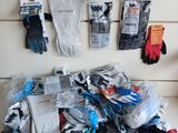 a pile of gloves and gloves sitting on a shelf