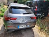 a silver car that is parked in a driveway