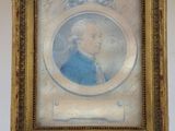 portrait of a man in a blue coat in a gold frame