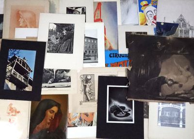 many different pictures on the wall of this room