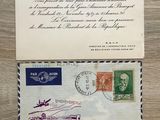 an old envelope with a stamp on it sitting on top of a wooden table