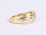 an image of a yellow gold ring with diamonds on a white background