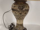 a lamp that is sitting on a table with a lamp on it