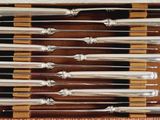 six knives in a box with a wooden handle