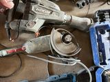 a man that is working on some tools on the floor