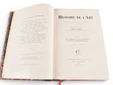 an open book with a picture of a cat on it