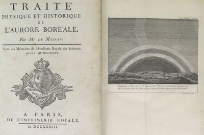 un vieux livre avec une image d'un arc-en-ciel dans le ciel