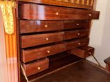 an image of a wooden desk with drawers in a room