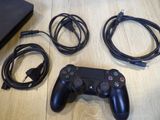 a video game controller and a charger on a table