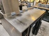 a stainless steel counter top in a commercial kitchen