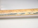 a close up of a piece of wood that has been stripped off