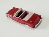 a toy car that is sitting on a white surface