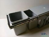 a picture of a trash can with two separate bins