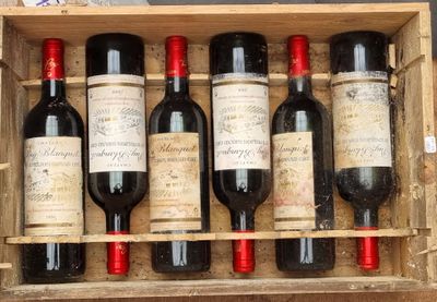 six bottles of wine in a wooden box