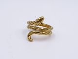 a gold snake ring on a white background