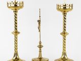 three brass candlesticks on a white background with a white background