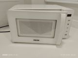 a white microwave sitting on a counter in a kitchen
