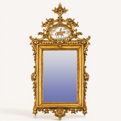a gold frame with a picture of a horse on it