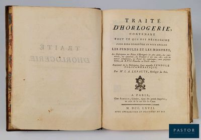 un livre ouvert sur lequel figure l'image d'un chien