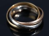 a close up of two rings on a black surface