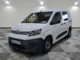 the white van is parked on a checkered floor in a room