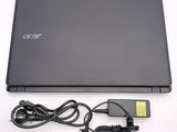 a black laptop with a power cord attached to it