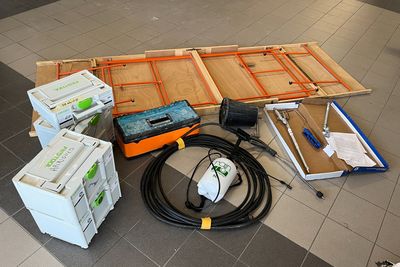 a lot of electrical equipment on the floor in the room