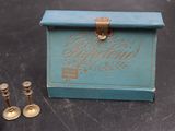 a small blue box that has some candles inside of it