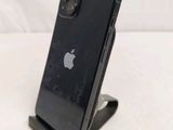 a black iphone that is sitting on a stand