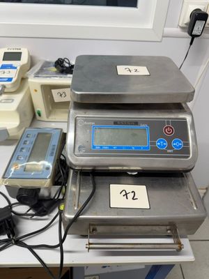 three electronic scales sitting on top of a table