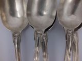 three spoons that are sitting next to each other