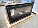 a television sitting on a pallet in a warehouse