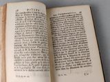 an open book on a table with a black and white picture