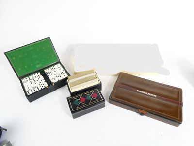 three dice pieces in a box on a white table