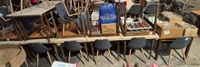a lot of chairs and tables that are on the ground