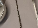 two spoons and a spoon rest on a table