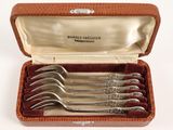 five forks in a box with a leather case
