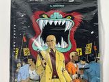 the cover of the comic book les faragess, featuring an image of a man in a yellow suit