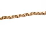 a close up of a gold bracelet on a white background