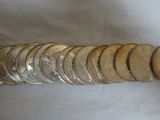 a pile of coins sitting on top of a white table