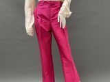 a mannequin wearing pink pants and a white blouse