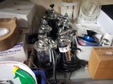 a bunch of silver and black items on a counter