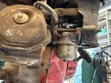 a close up of a motorcycle engine with a chain