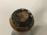 a wine bottle with a cork stopper on it