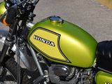 a yellow and black motorcycle parked on the side of the road