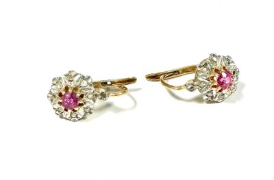 a pair of pink sapphire and diamond earrings on a white background