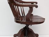 an image of a wooden chair with a wooden arm rest